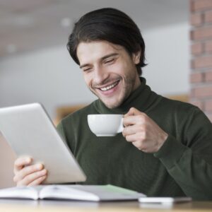 young-successful-businessman-checking-emails-while-having-morning-coffee.jpg